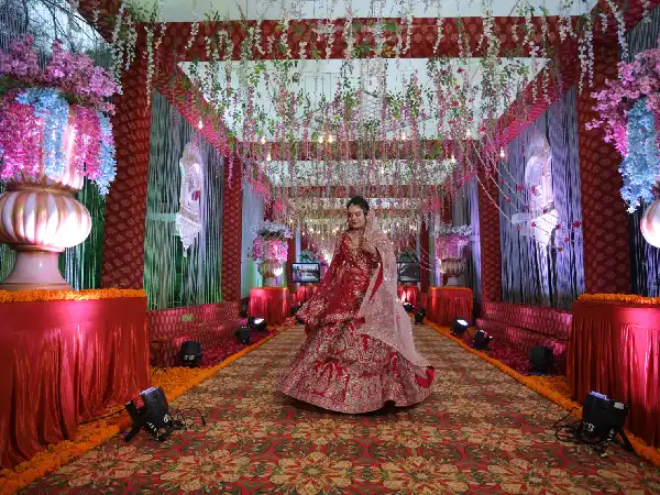 Grand Entry: Ornate pillars; heavy drapery; layered floral garlands