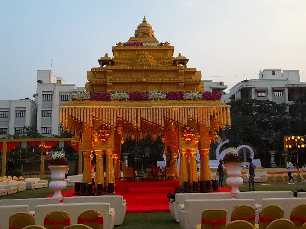 Wedding: Golden temple mandap; red carpet; ornate seating