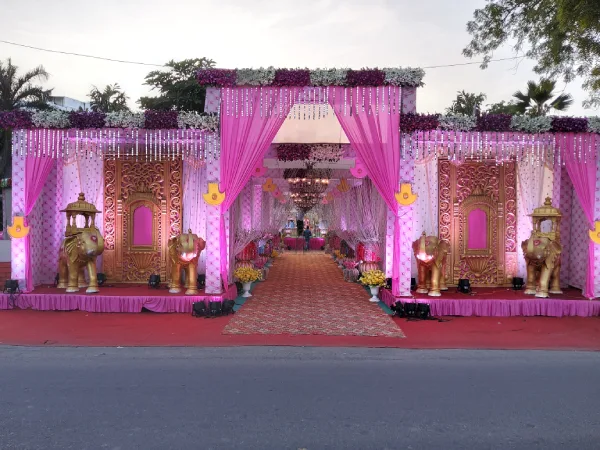 Reception: Pink drapery; floral pillars; soft ambient lighting